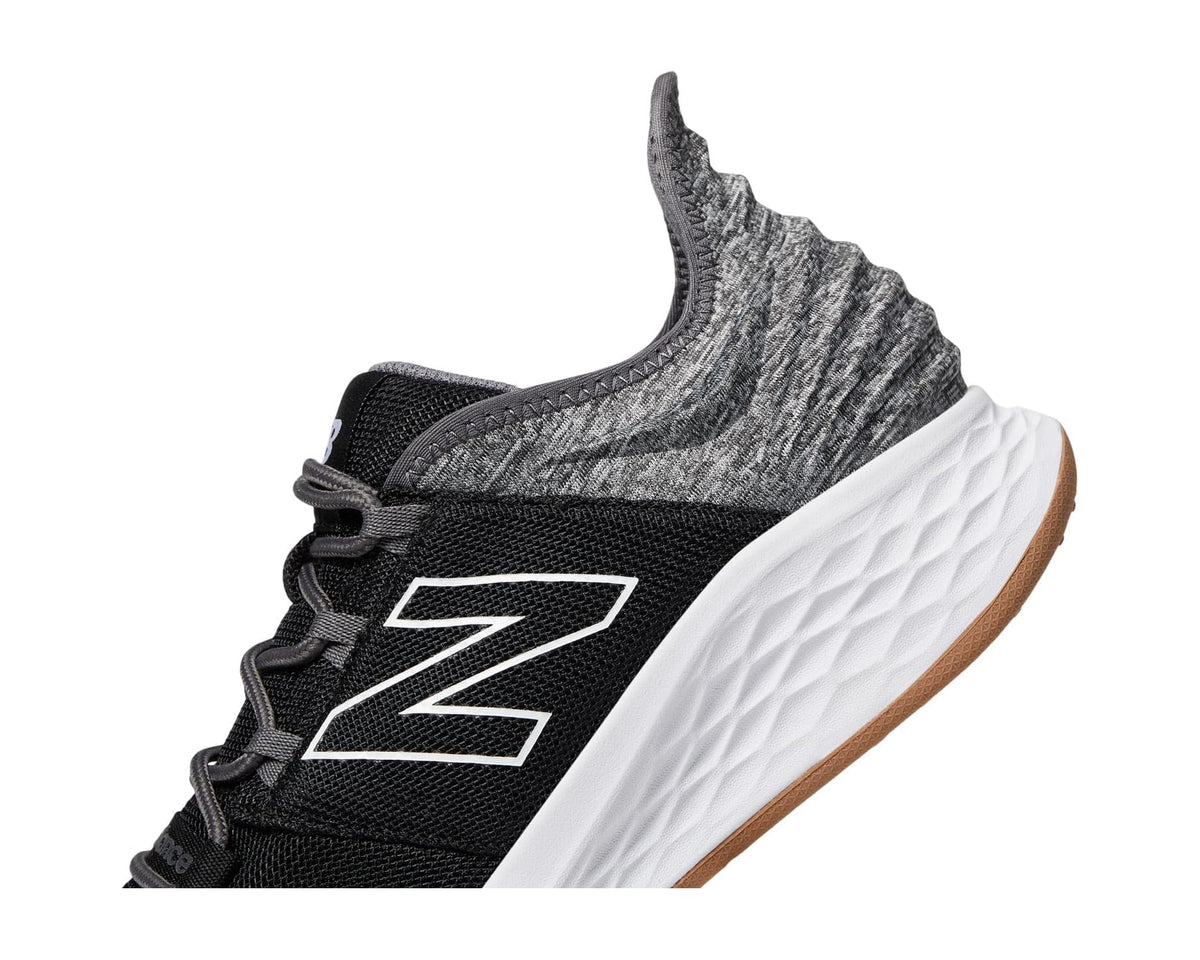 Black and gray New Balance golf sneaker with ribbed collar and white outsole