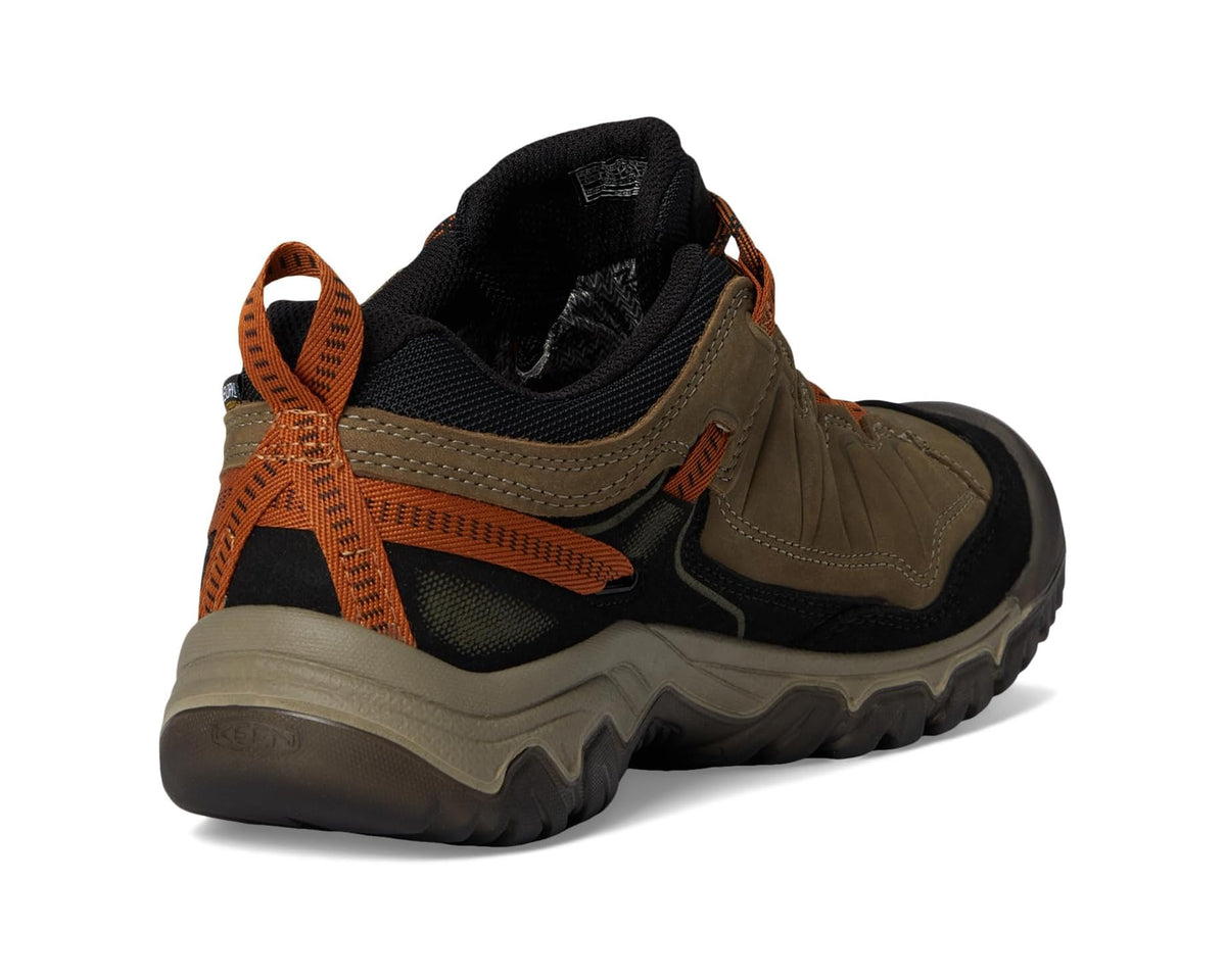 Men's KEEN waterproof hiking shoe heel, black collar with orange pull tab accents
