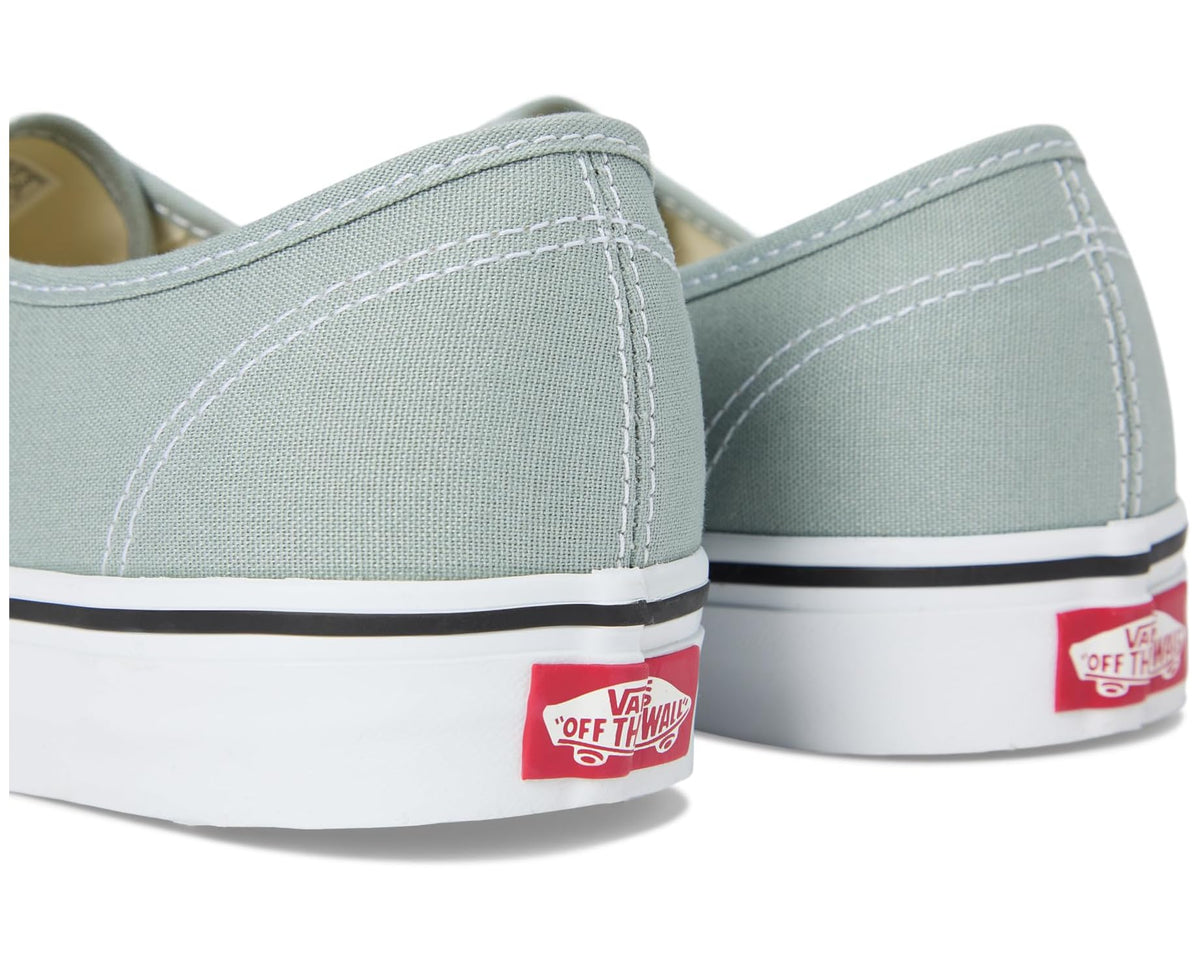 Vans low-top sneakers back view with white rubber sole and red heel branding
