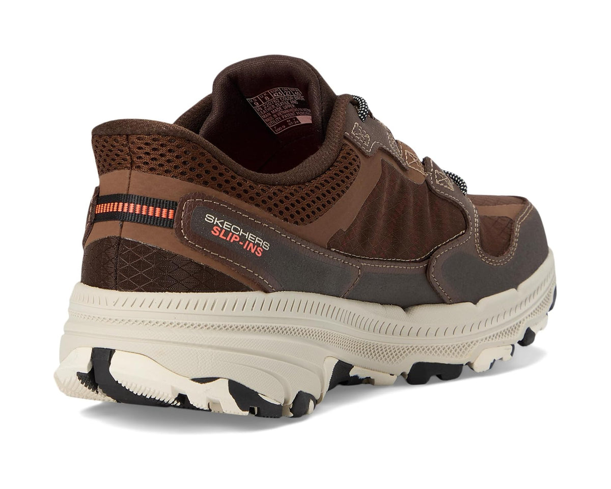 Brown slip-in sneaker heel and side view with orange stripe detail and S logo