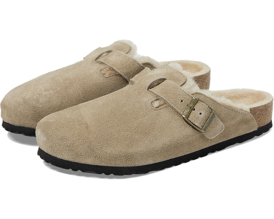 Taupe suede shearling clogs with adjustable buckled strap and open top