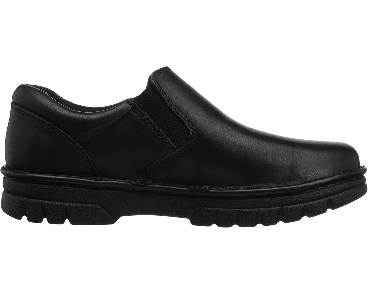 Black leather slip-on shoe with smooth vamp panel and chunky tread sole