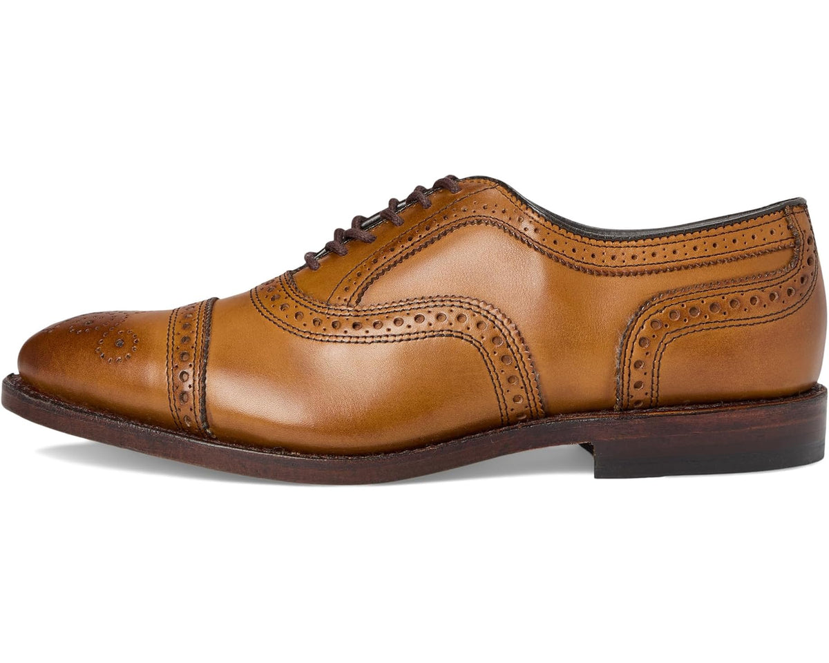 Men's walnut-brown leather oxford shoe, side profile with brogue trim