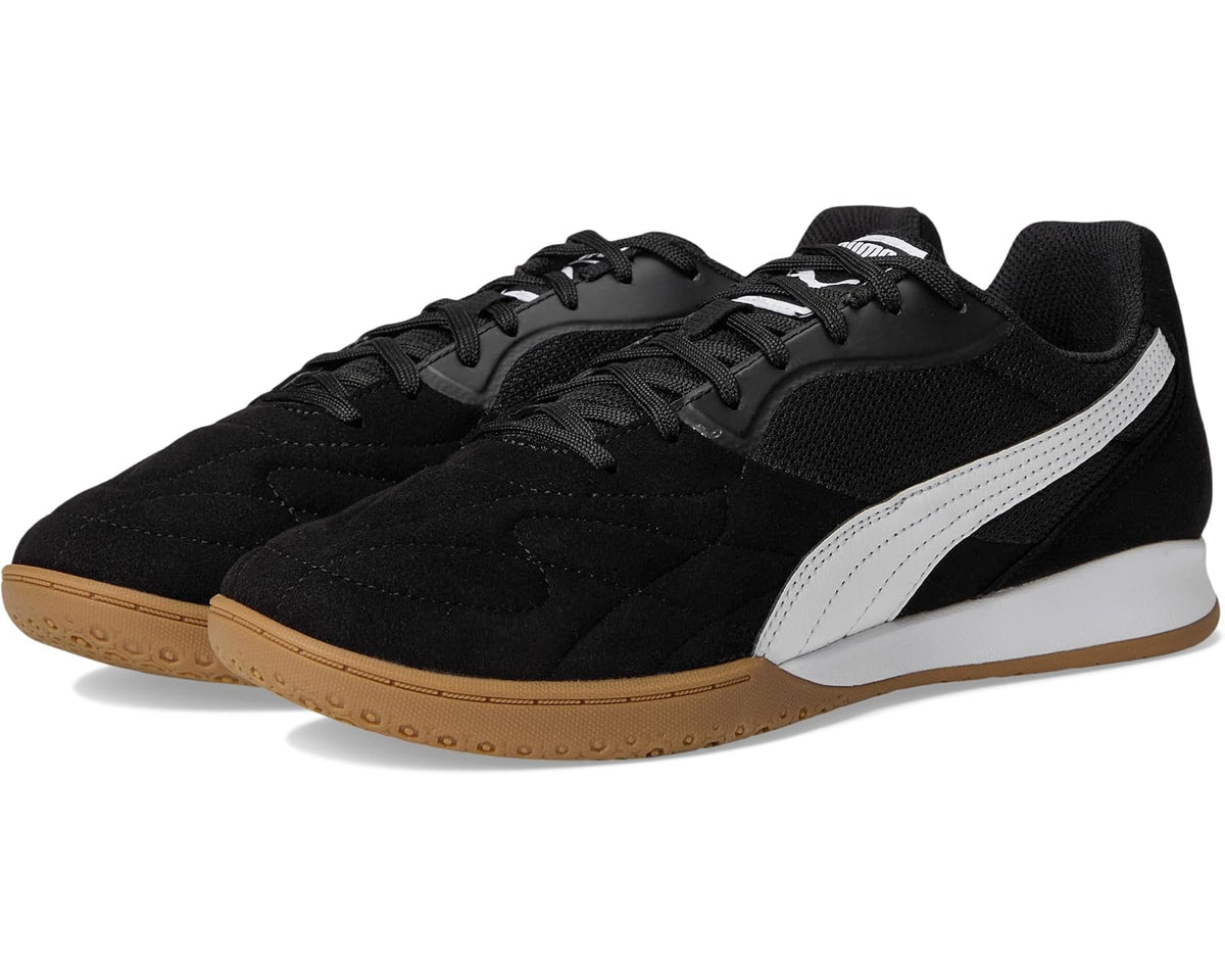 Men's indoor soccer trainer shoes in black with white Puma stripe and gum sole