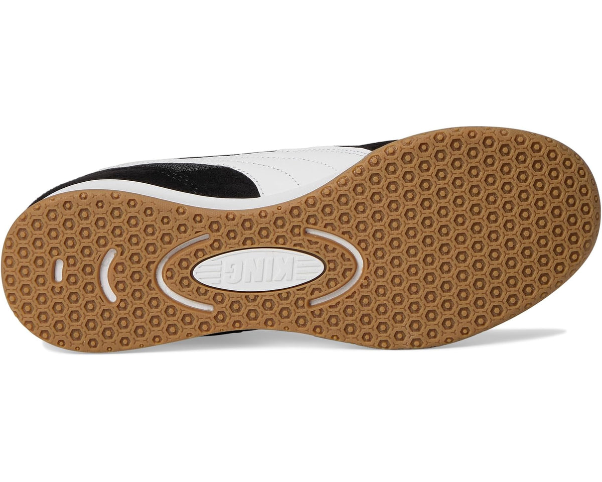 Indoor soccer trainer shoe outsole with gum-brown patterned tread and UNITE branding
