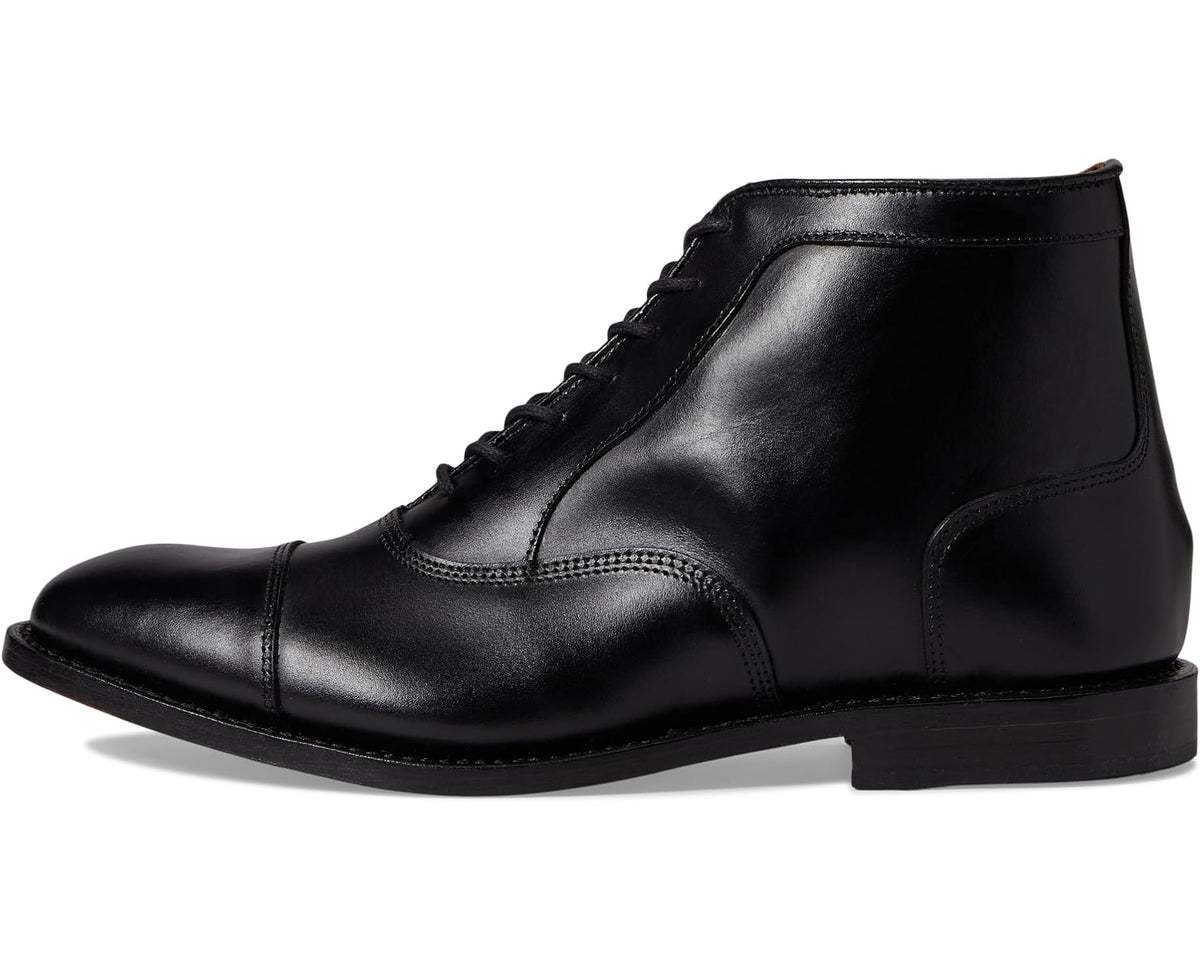 Black leather lace-up ankle boot with sleek toe and stitched upper