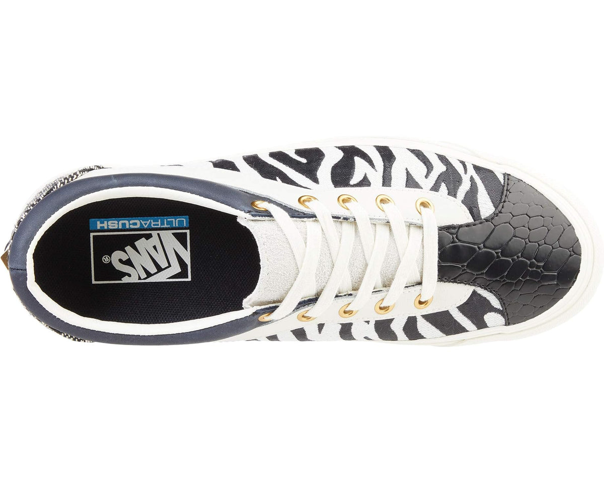 Unisex zebra-pattern low-top skate shoes showing black interior and SMN logo patch