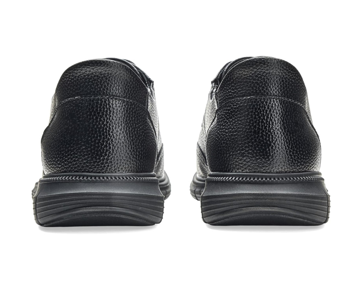 Men's black leather lace-up shoes shown from the back with stacked heel sole