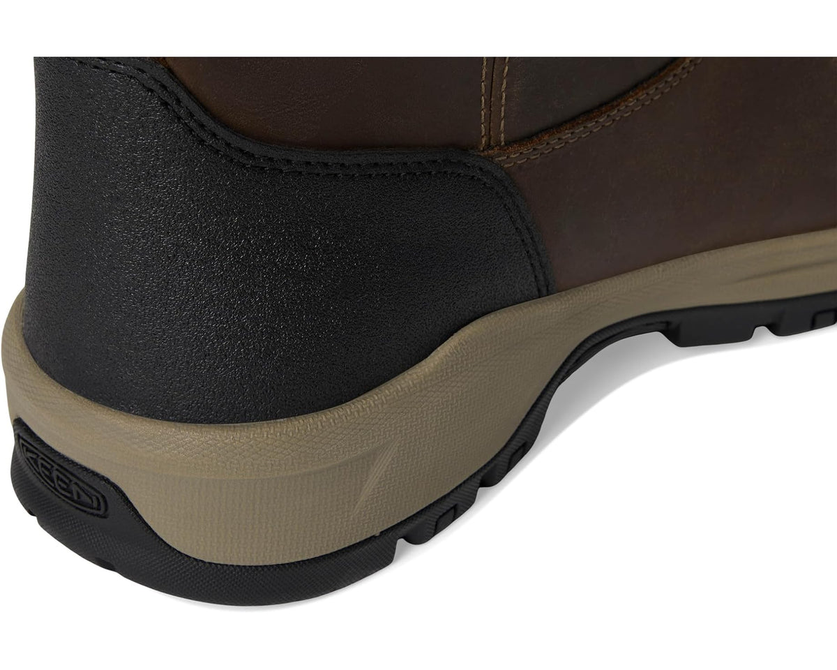 Black and brown boot heel with textured rubber midsole and seam details