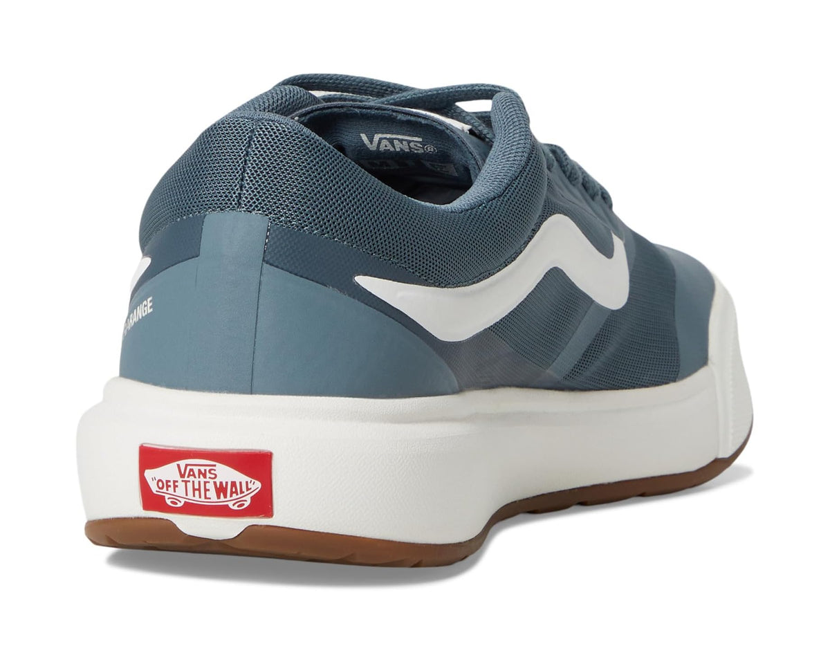 Unisex blue sneakers with heel pull tab, red Vans logo patch, and white sole
