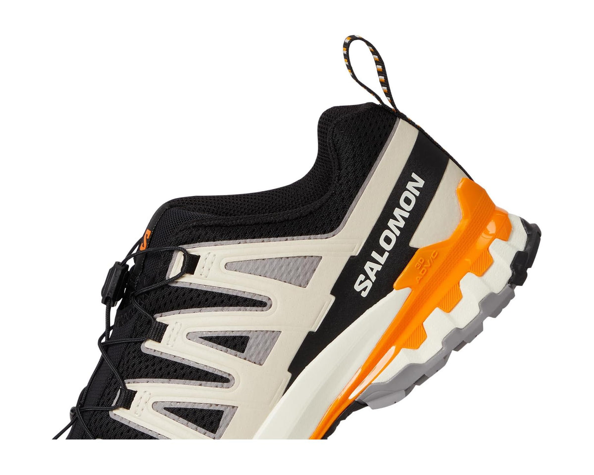 Men's trail running shoe heel close-up with black collar, gray panels, and orange side support.
