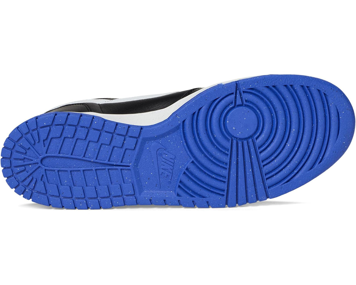 Nike low-top sneaker outsole with blue tread pattern and white midsole edge.