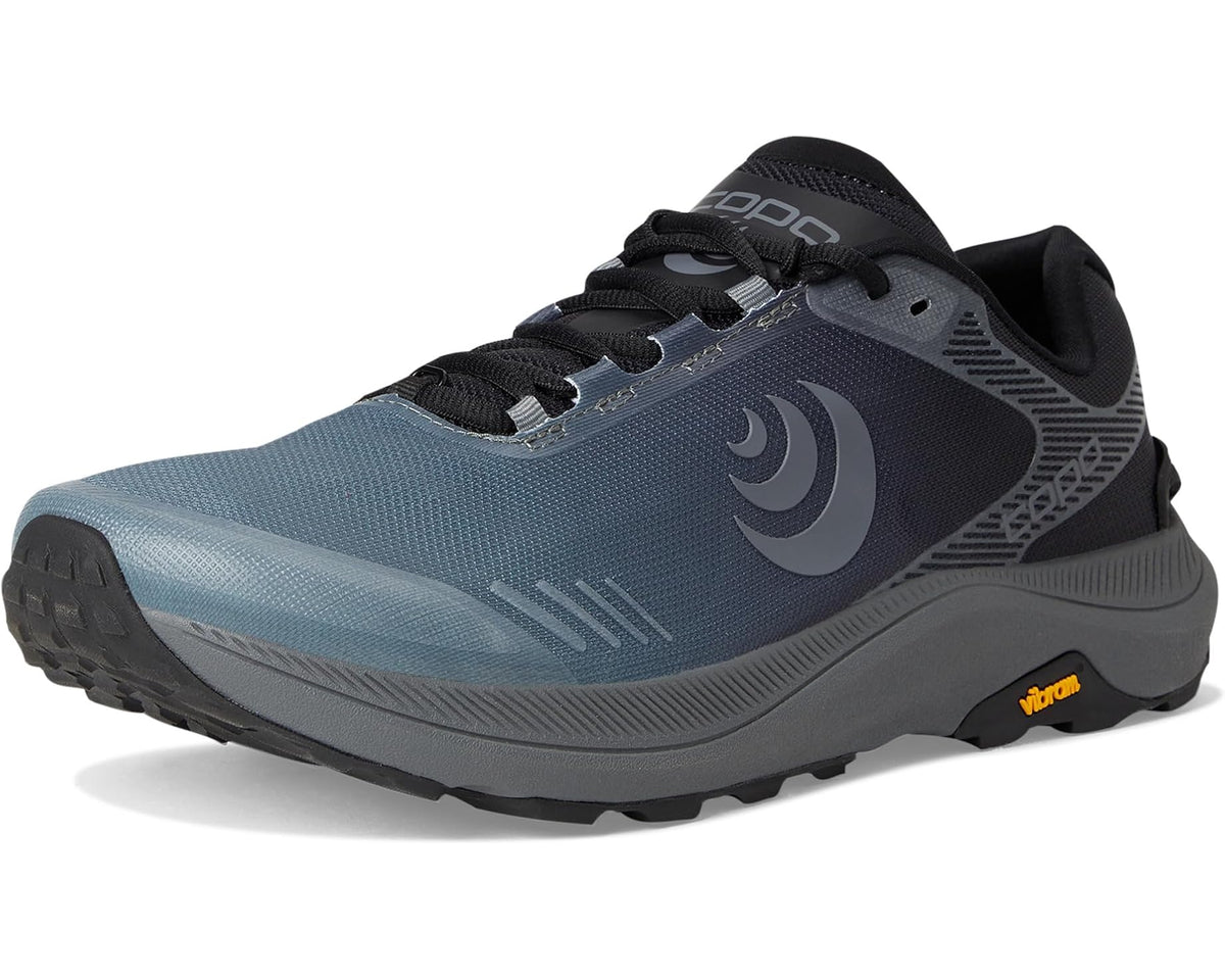 Men's Topo athletic trail running shoe, angled side view with black overlays and laces