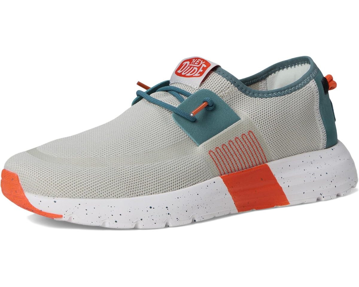 Men's Hey Dude Sirocco M active sneakers, front 3/4 view with teal collar and orange sole