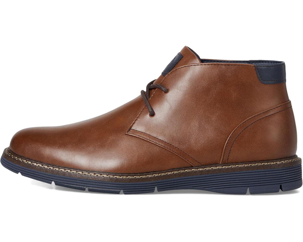 Cognac leather ankle boot with navy collar, lace-up closure, and stitched sole