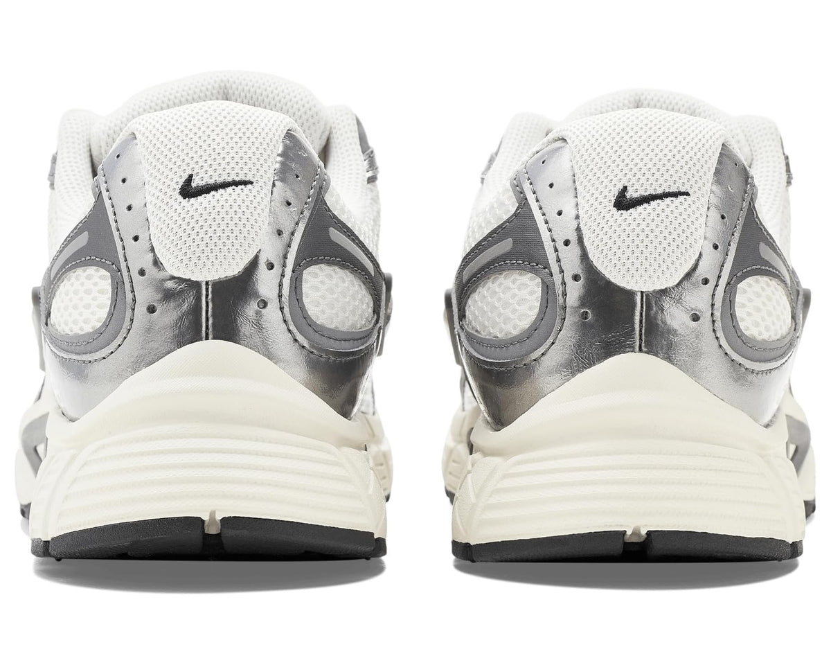 Nike V5 runner heel view with cream midsole, white collar, and gray outsole