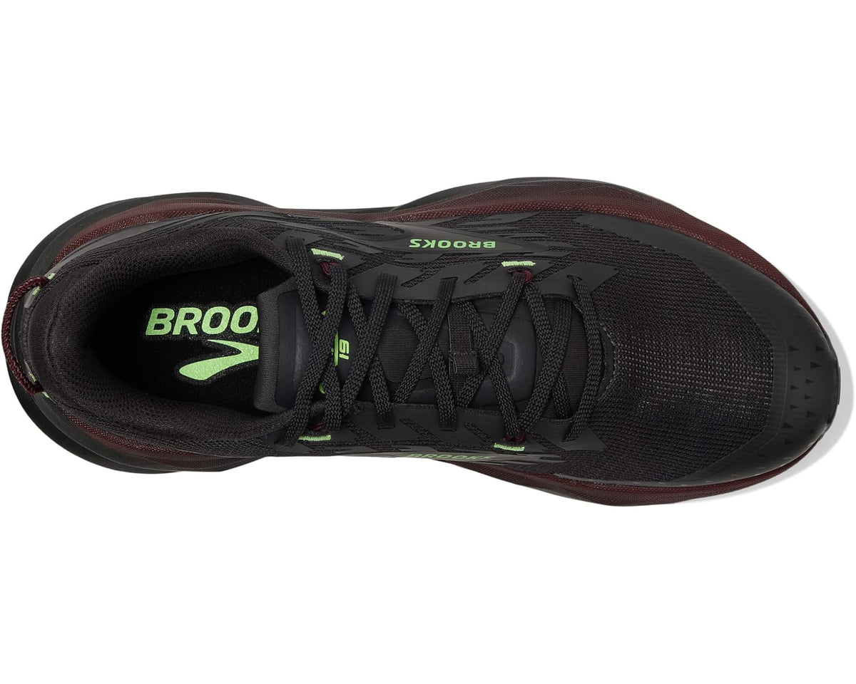 Men's black lace-up trail shoe interior with green tongue text and padded collar