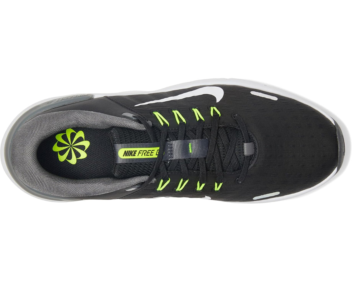 Nike golf shoe top view, black upper with neon green laces and NIKE FREE strap.