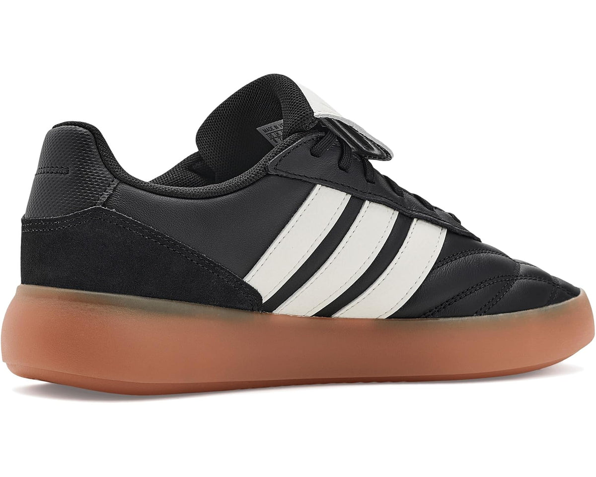 Men's adidas Barreda Mundial low-top sneaker, black upper with white side stripes and gum sole