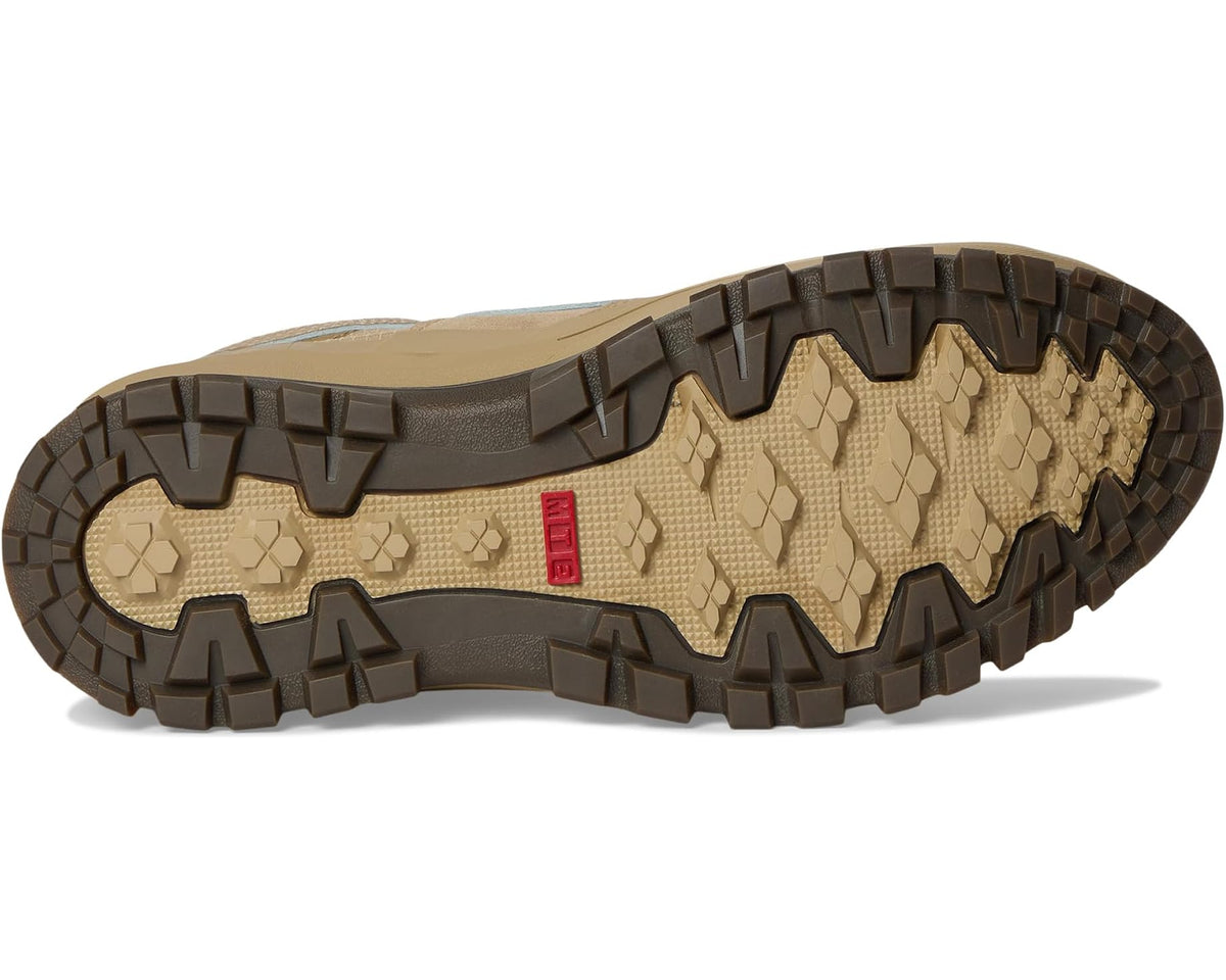 Beige high-top boot outsole with rugged tread pattern and red logo patch.