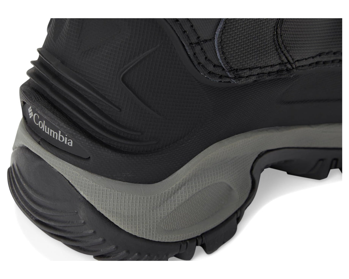 Black boot with molded side panel and gray midsole with tread details.