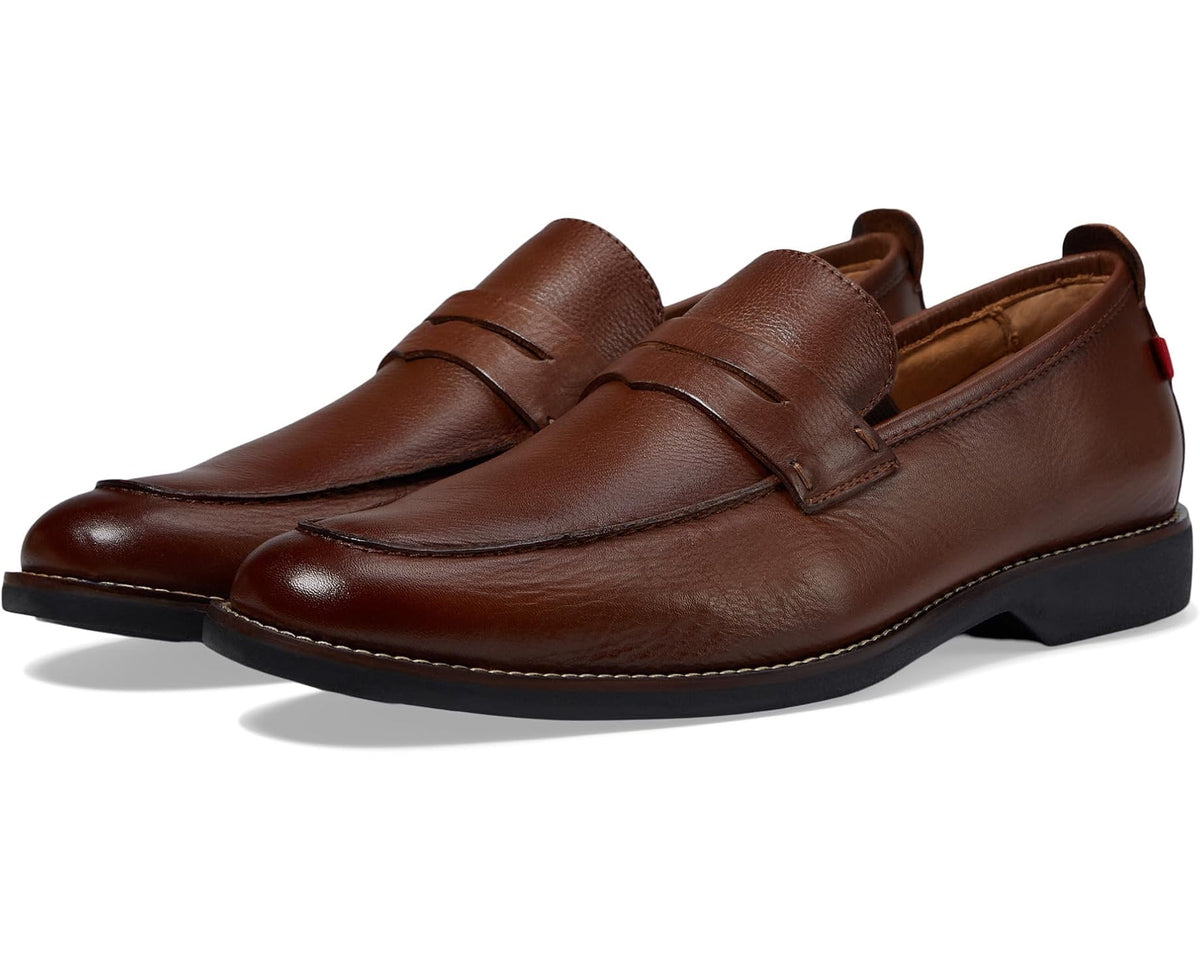 Men's brown leather slip-on loafer with stitched vamp and penny strap
