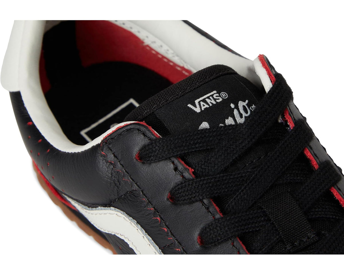 Vans unisex black sneakers with red stitching, woven tongue label, and lace eyelets