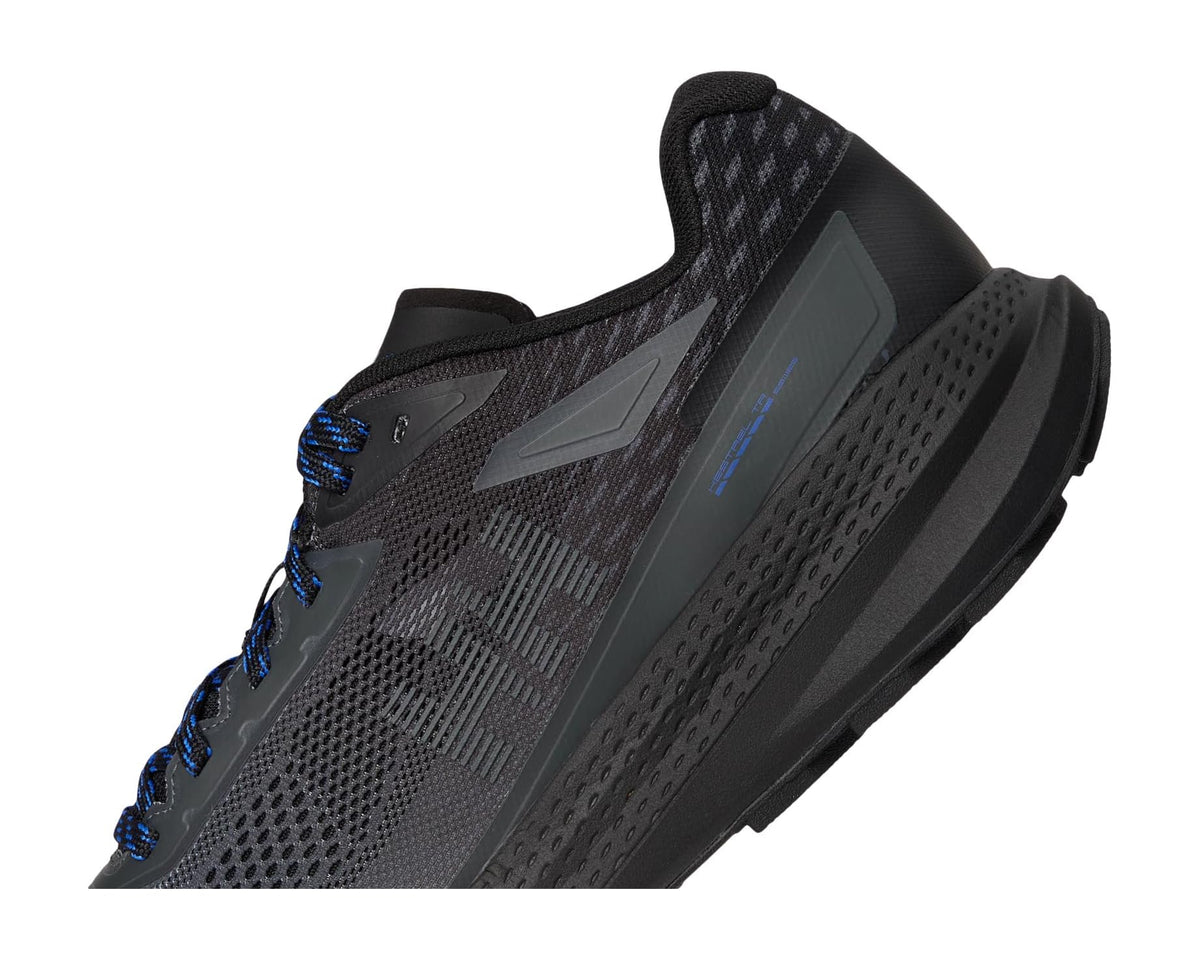 Black side view trail running shoe with blue laces and textured paneling