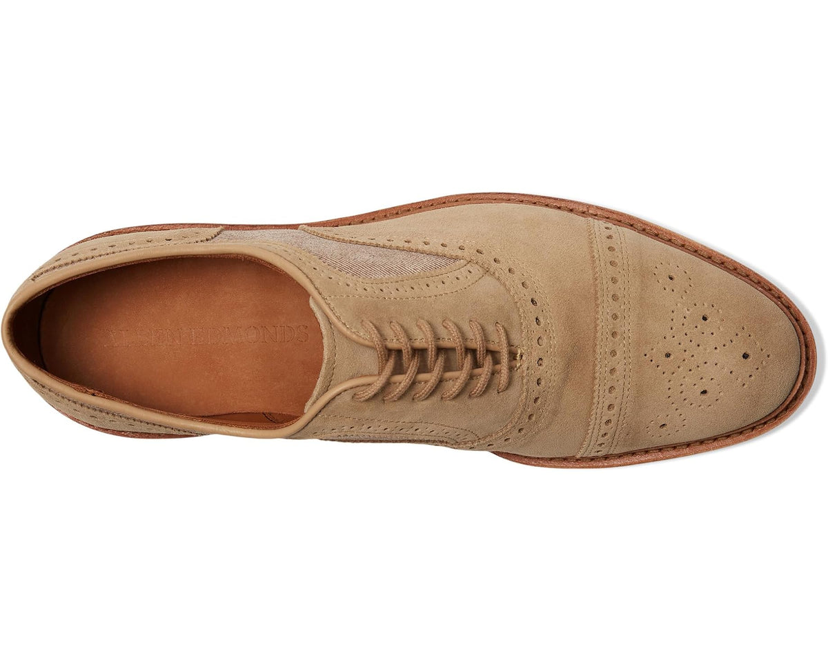Men's bone suede oxford shoes, side profile with lace-up and brogue-style perforations