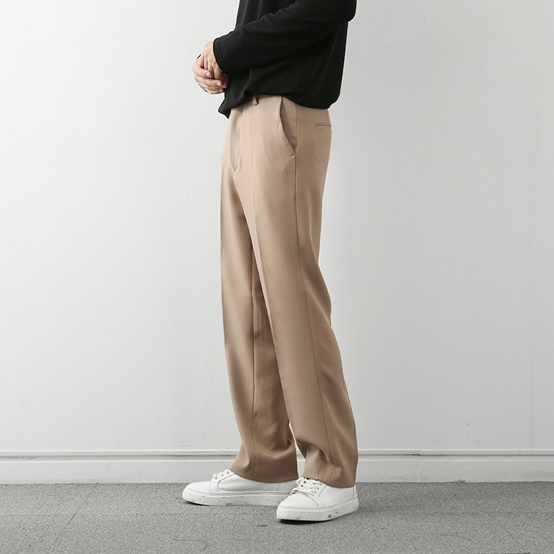 Tan loose straight trousers with relaxed fit, long inseam, and straight leg