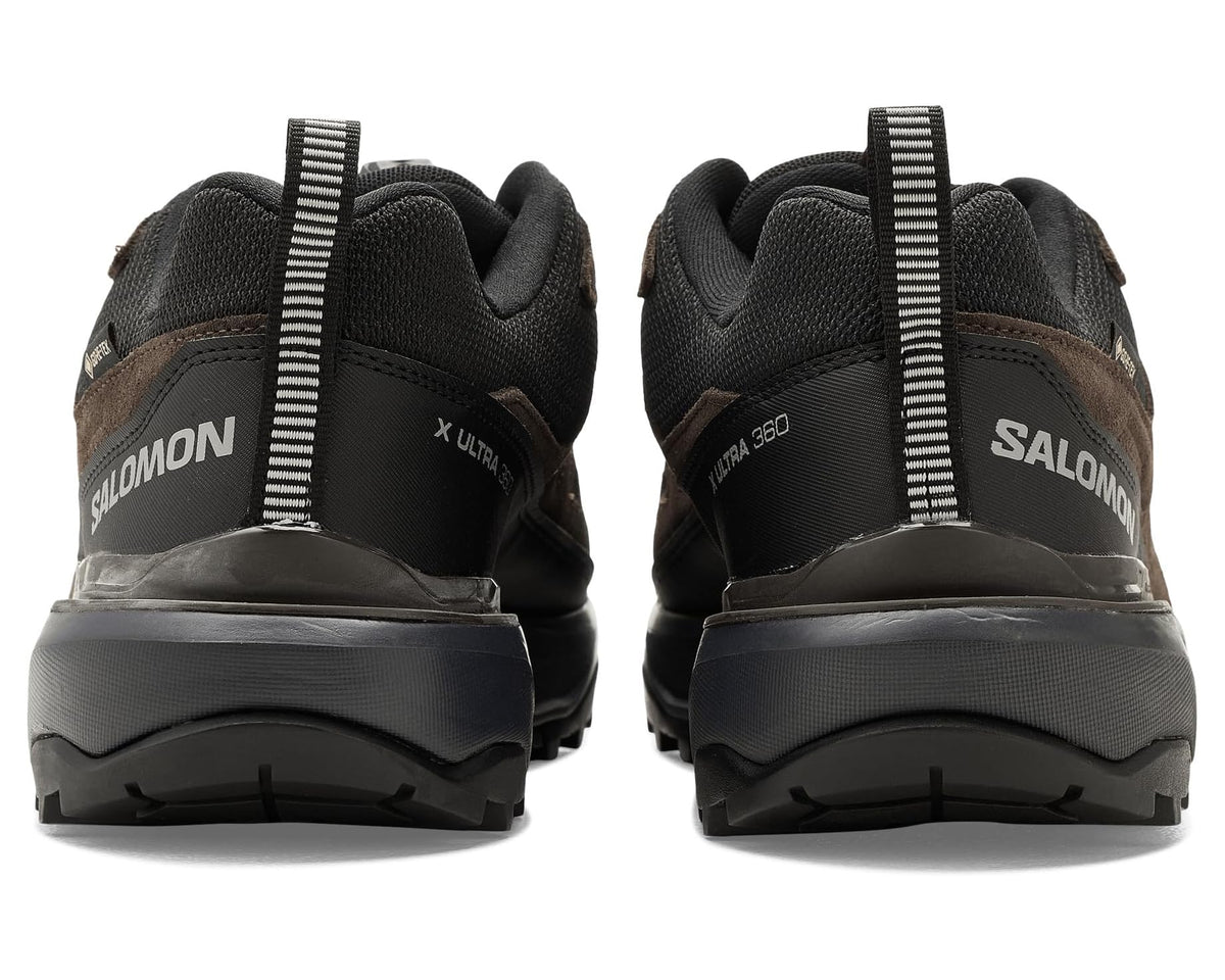 Men's Salomon hiking shoes back view, black heel collar and dark earth uppers