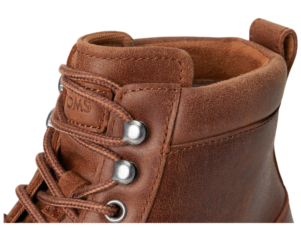 Tan leather ankle boot with metal D-rings, lace hook, and stitched collar