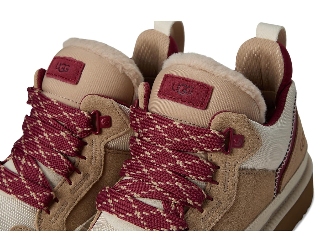 Men's UGG low-top sneakers, close-up of laces: burgundy woven laces over tan suede panels.