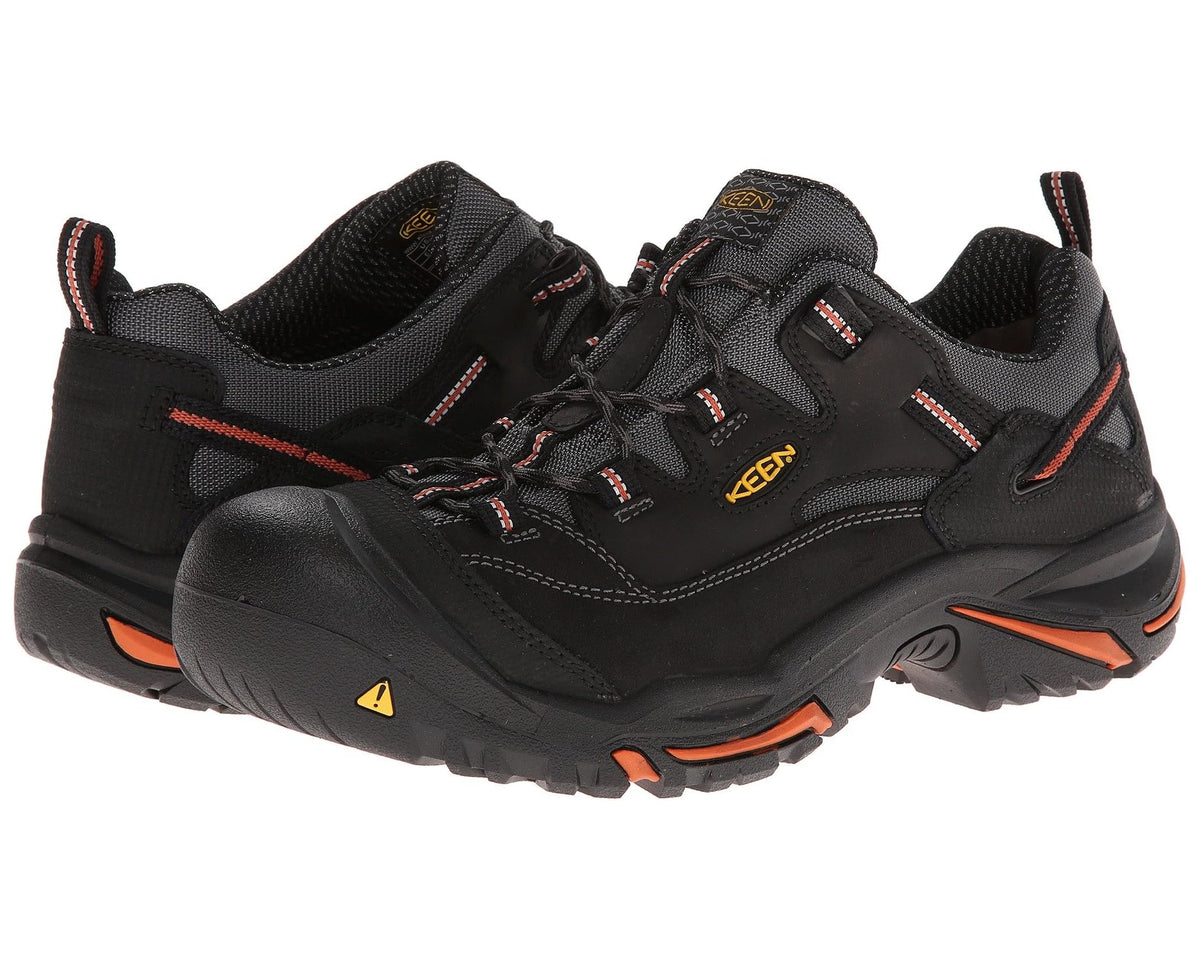 KEEN Braddock Low men's black steel-toe work sneaker with orange accents and laces