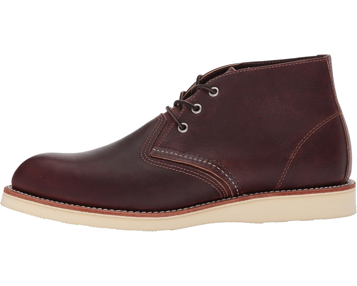 Dark brown leather chukka boot with lace-up and cream rubber sole