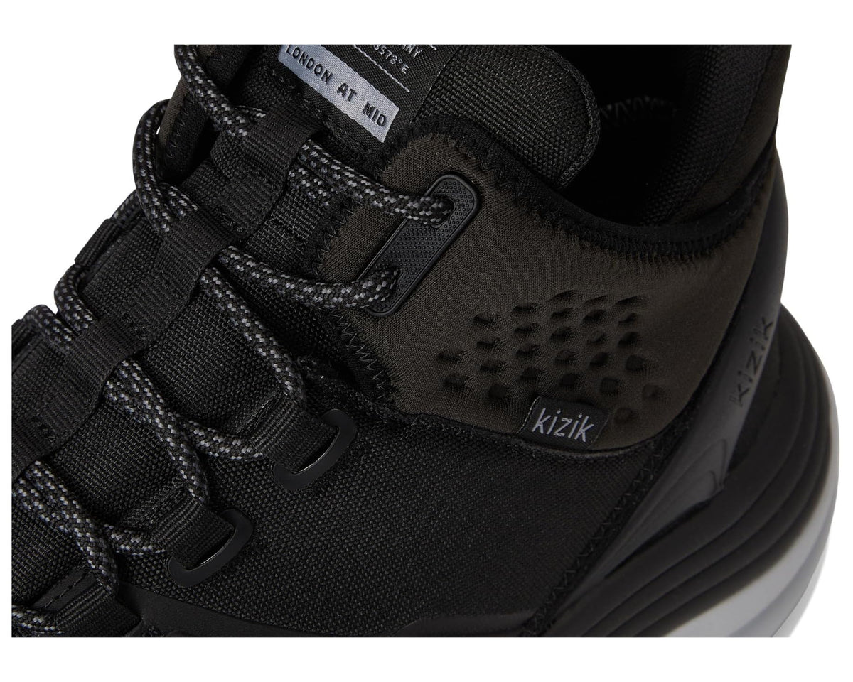 Black shoe upper close-up with textured side panel and lace-up hardware