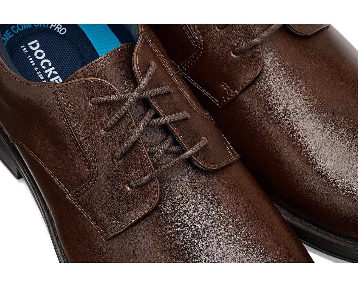 Close-up of men's chestnut brown leather lace-up oxford shoes and stitching
