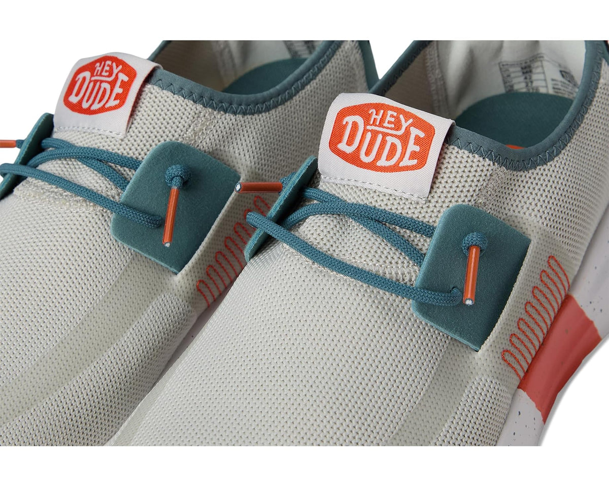 Men's Hey Dude Sirocco M active sneakers, close-up of teal laces and orange-stitch panel