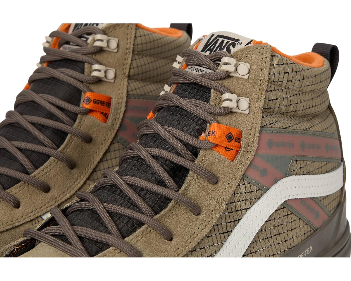Close-up of brown and khaki high-top sneaker laces, strap, and GORE-TEX branding
