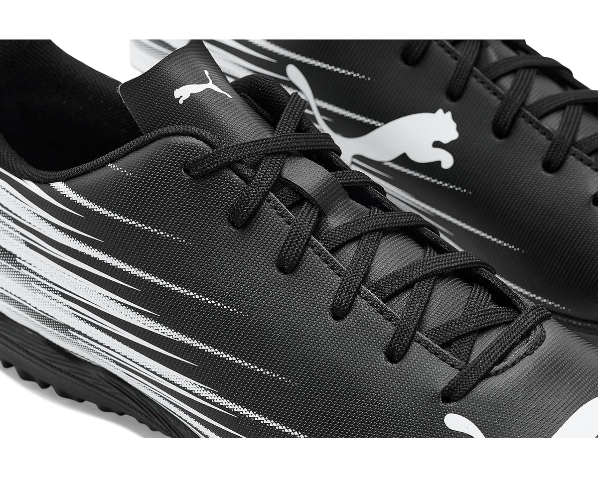 Close-up of black lace-up turf cleat with white stripe graphics and PUMA logos