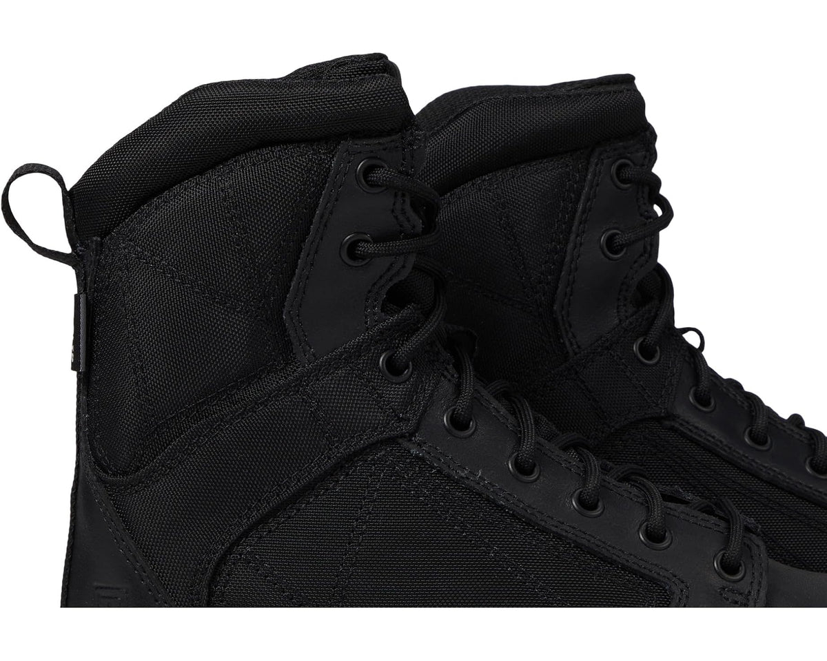 Black tactical boot upper close-up with laces, eyelets, and stitched panels