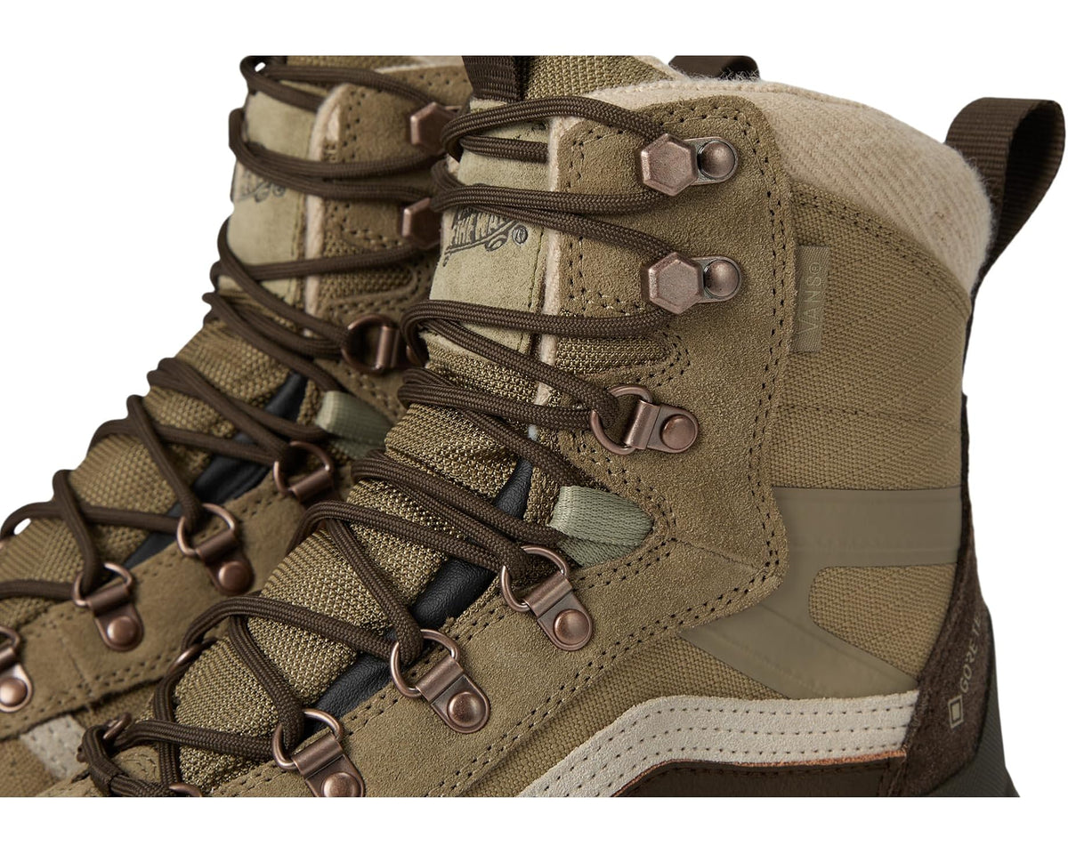Unisex snow boot upper close-up with metal D-ring eyelets and textured panels