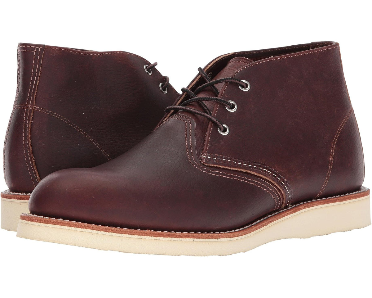 Brown leather chukka boot with lace-up eyelets and cream rubber sole