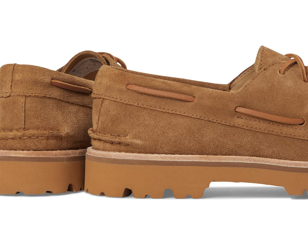 Tan suede boat shoes side view showing lace-up panel and lug sole