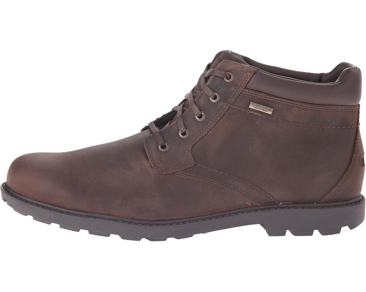 Tan lace-up plain-toe boots with padded collar, seam stitching, and rubber traction sole
