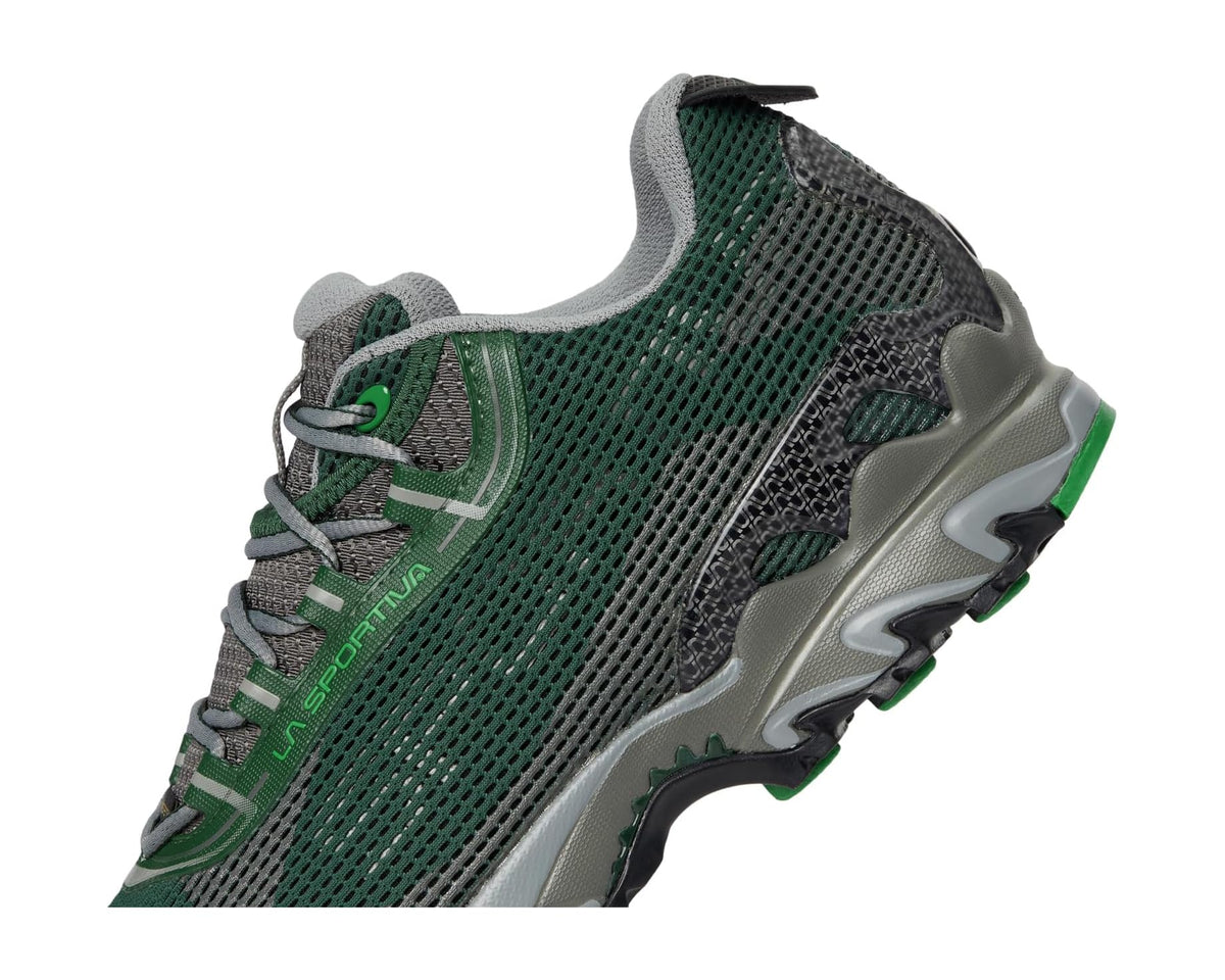 Men's green mesh trail shoe side view with lace panel, gray overlays, and rugged sole