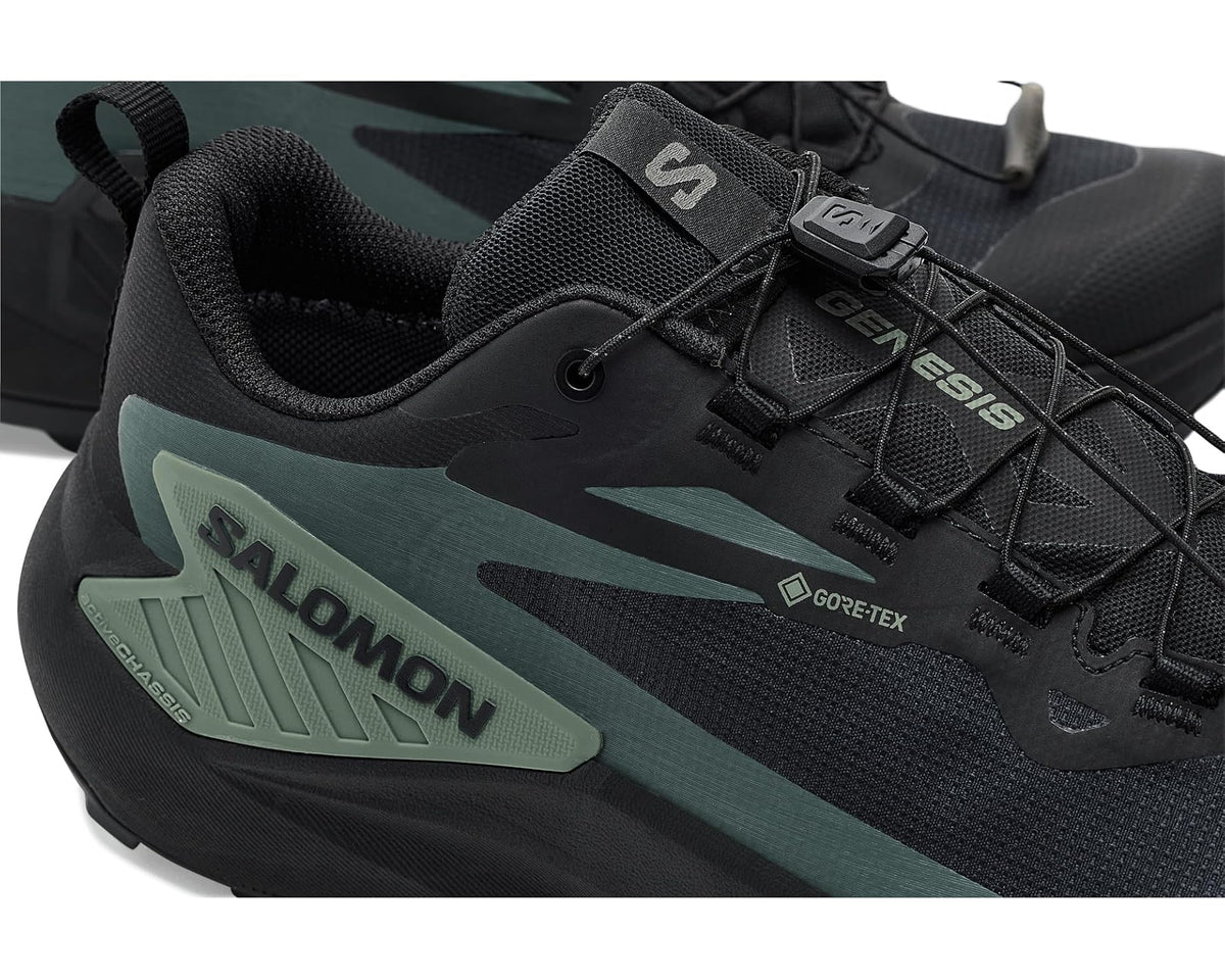 Close-up of men's Salomon Genesis laces and Gore-Tex logo on black upper with green