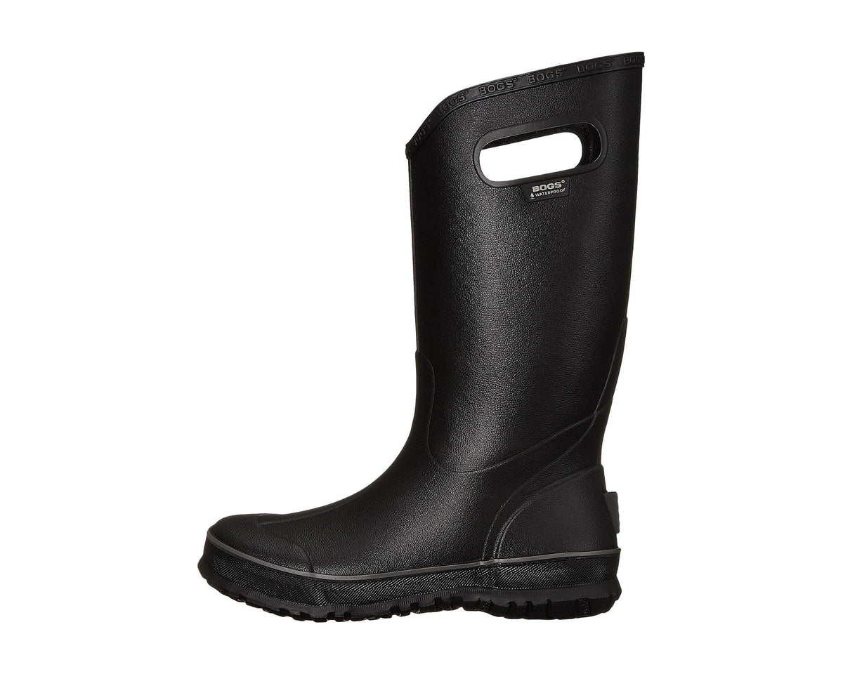 Black rain boot side view with pull-on strap and molded logo patch
