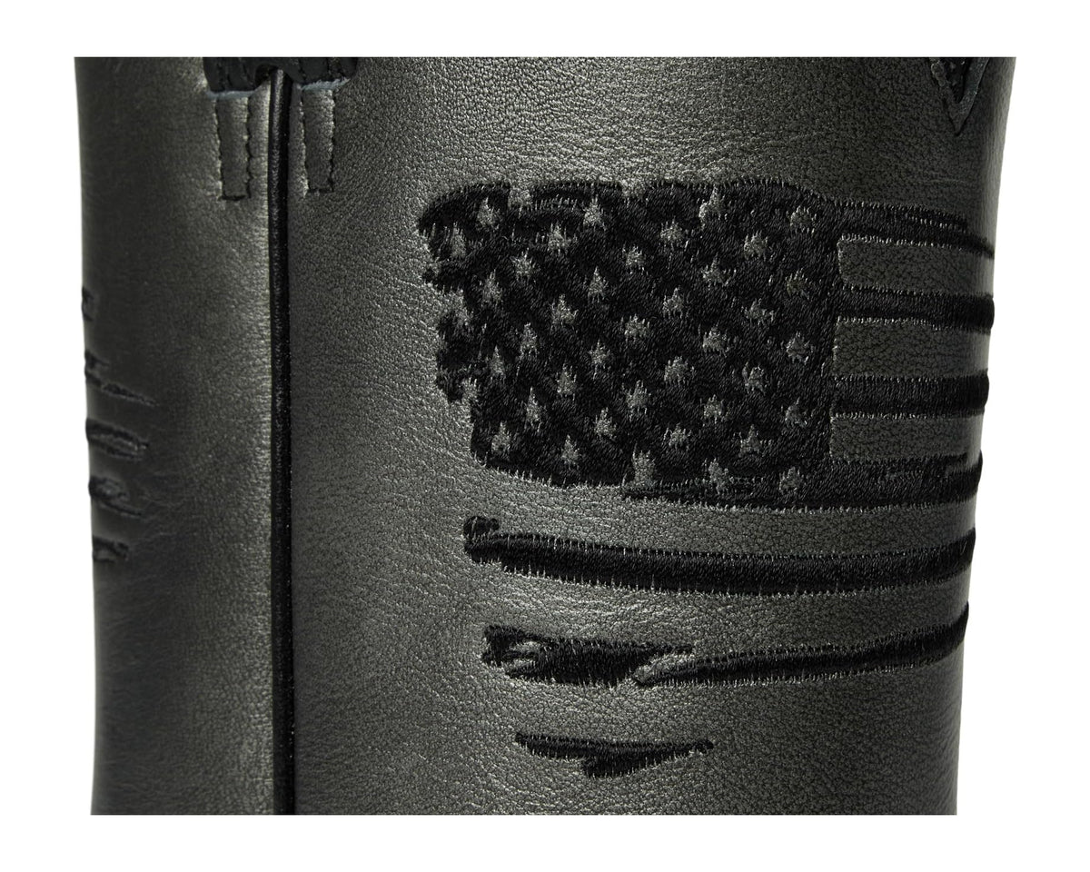 Black boot shaft detail with patterned flag patch and stitched western graphics