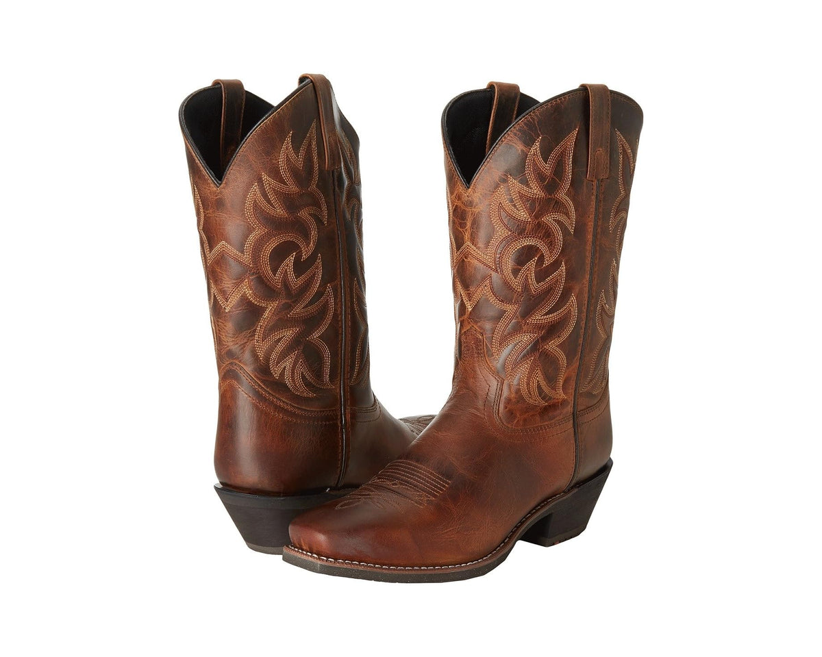 Men's rust-brown western boots with ornate floral embroidery and distressed finish